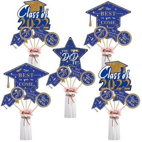 blue and gold graduation centerpieces|More.